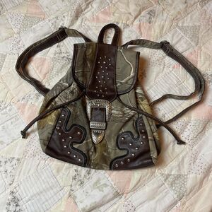 realtree y2k brown and green camo buckle medium sized book bag